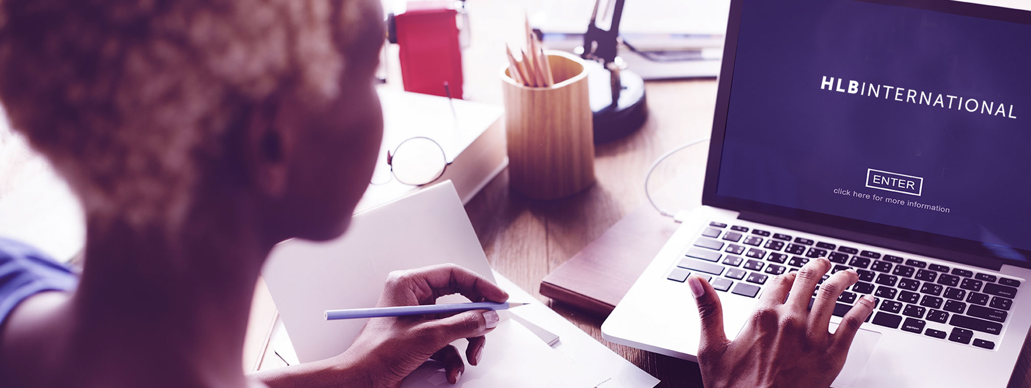 Tax consultant reviewing financial documents for a business in Tajikistan